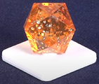 An orange Power Gem from the board game. Notice the glitter inside this power gem.